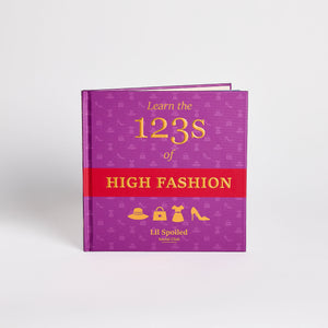 Purple book titled 'Learn the 123s of High Fashion' with a red section on a white background
